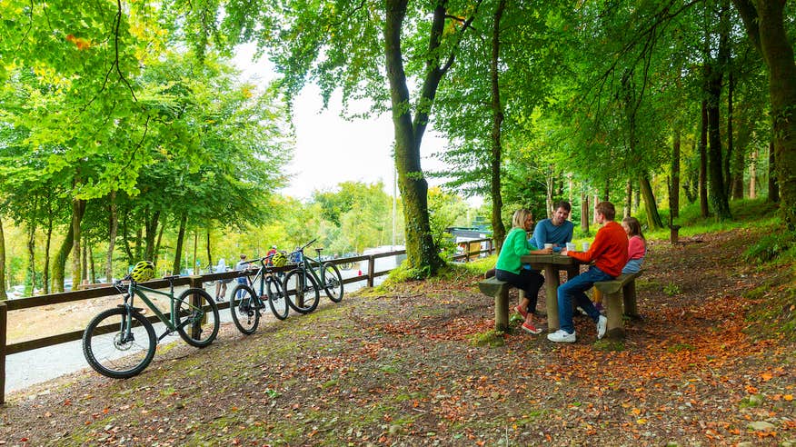 A family of four taking a break from cycling on the Ballyhoura Mountain Bike Trails in County Limerick.